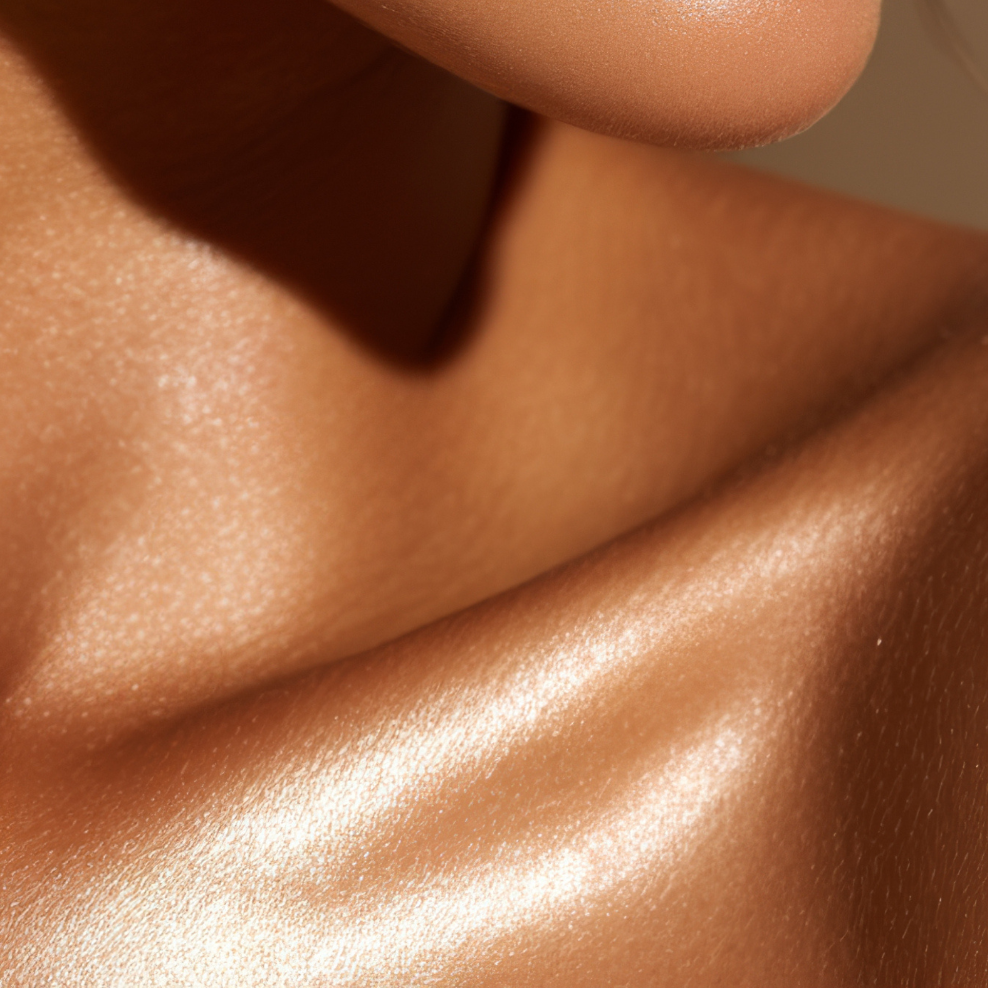 Close-up of smooth, golden bronzed skin after an at-home spray tan