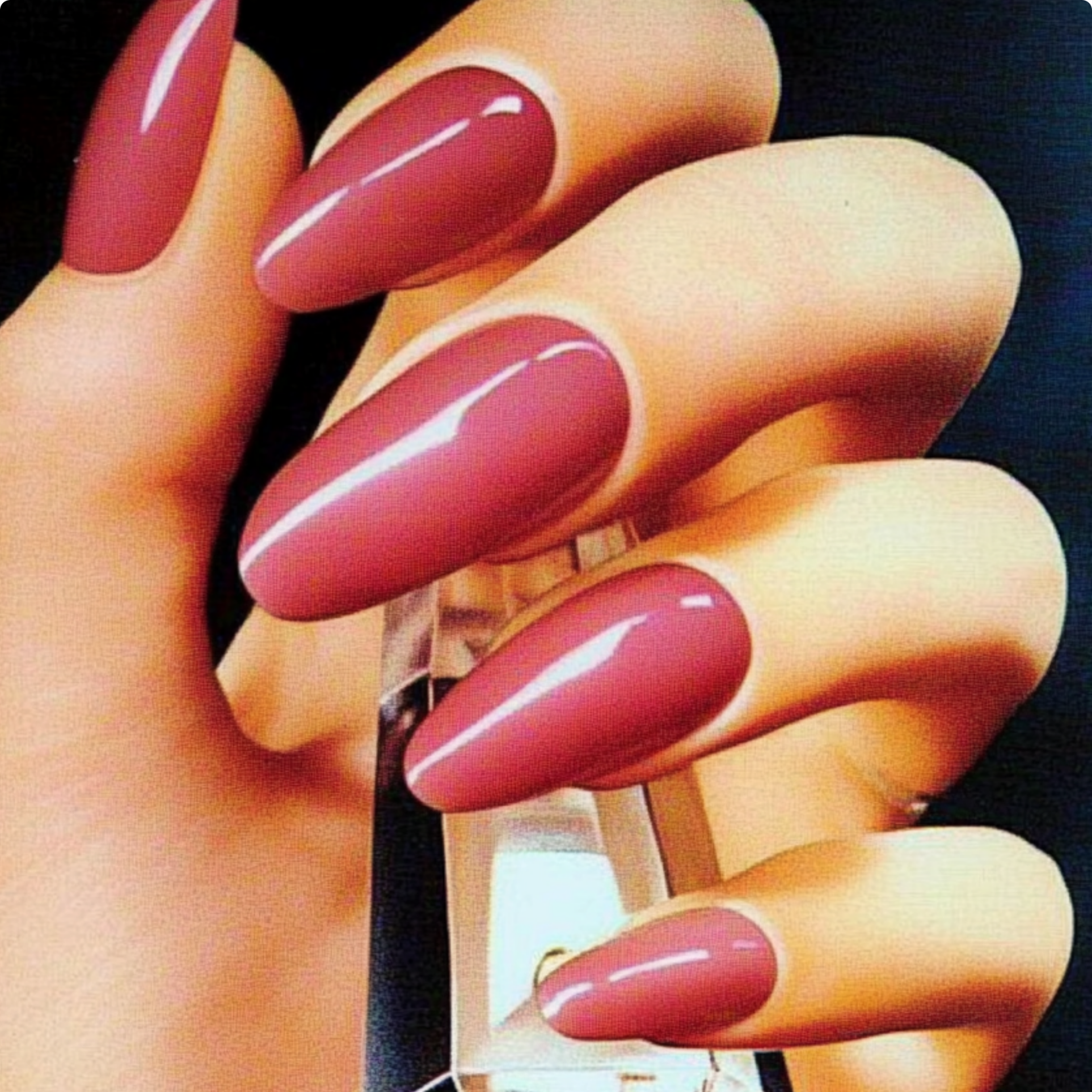 Close-up of glossy almond-shaped nails in a deep rose gel manicure