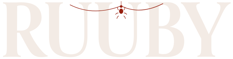 The Ruuby wordmark with a spider dangling from a thread across it