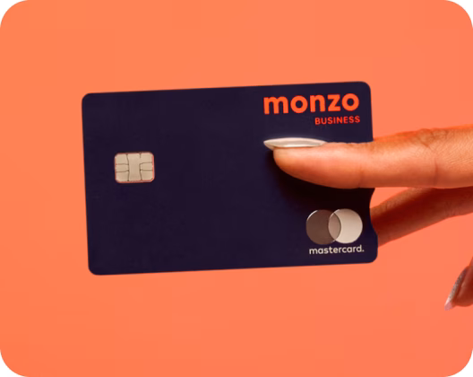 Close up of a monzo business debit card between fingers