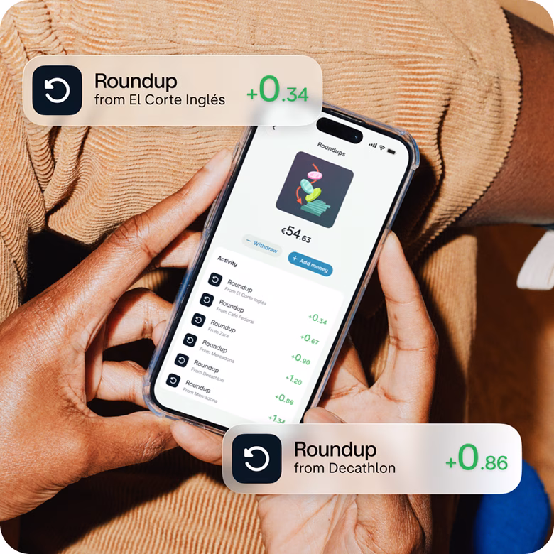 Phone showing Round-ups automatically saving spare change after purchases.