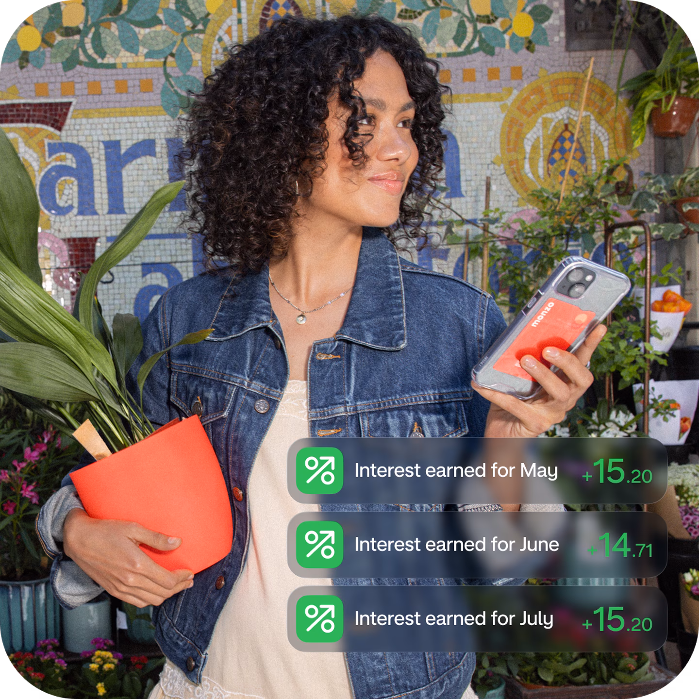 Person holding a phone while interest amounts appear, highlighting instant-access savings.