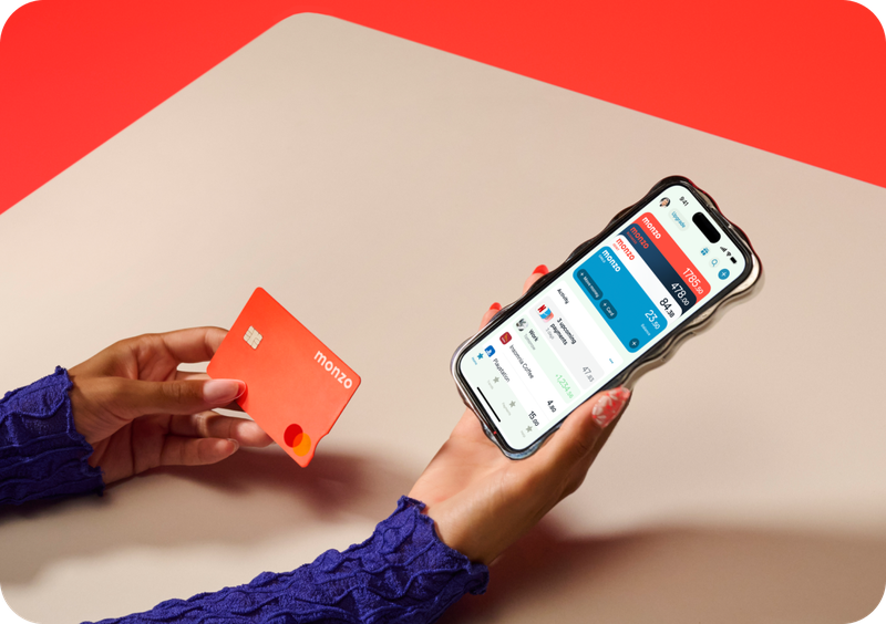 Person on phone holding hot coral card
