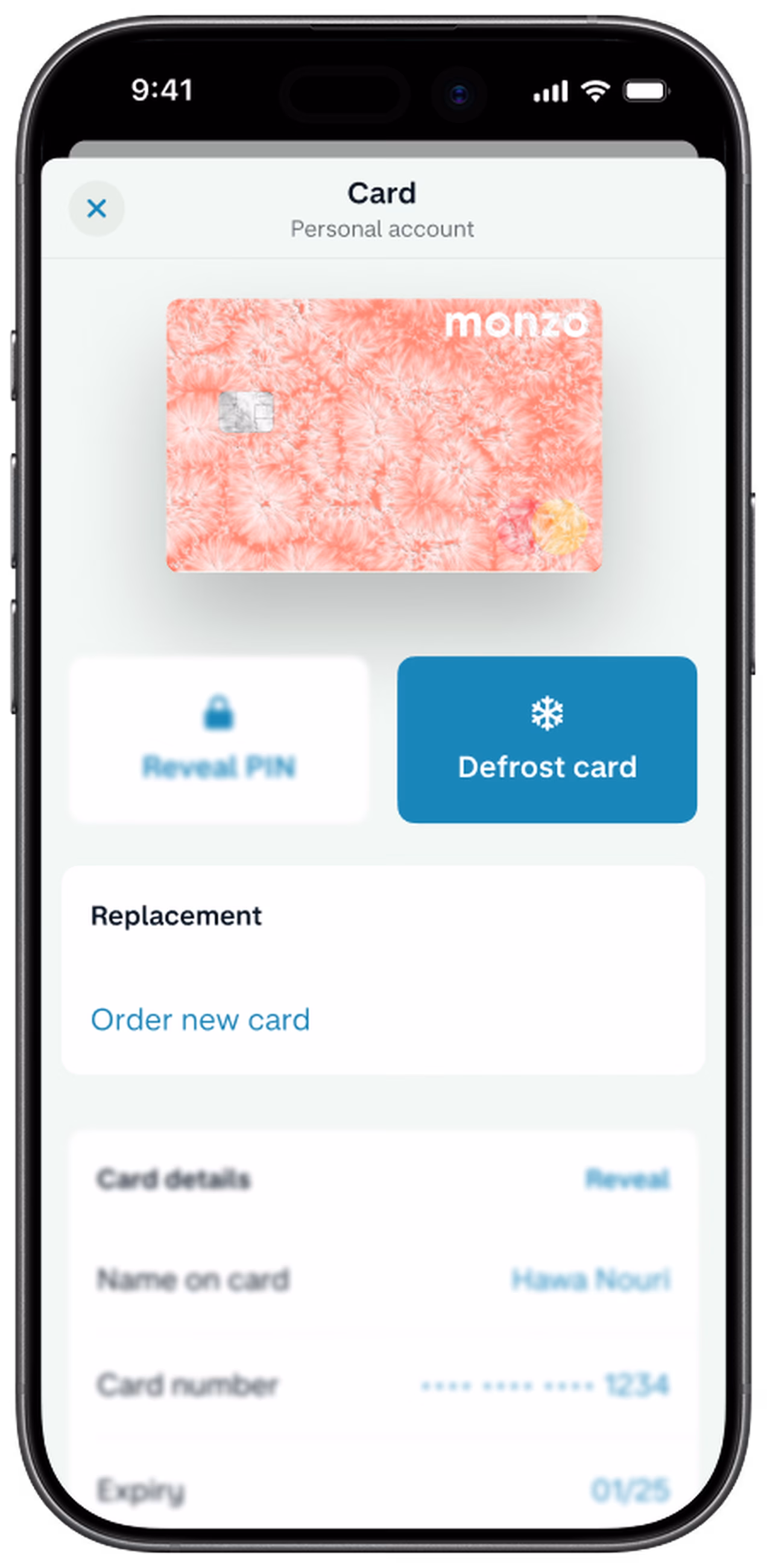 A smartphone screen shows the Monzo app's card management page, displaying a hot coral card and option to freeze card or order a replacement card.