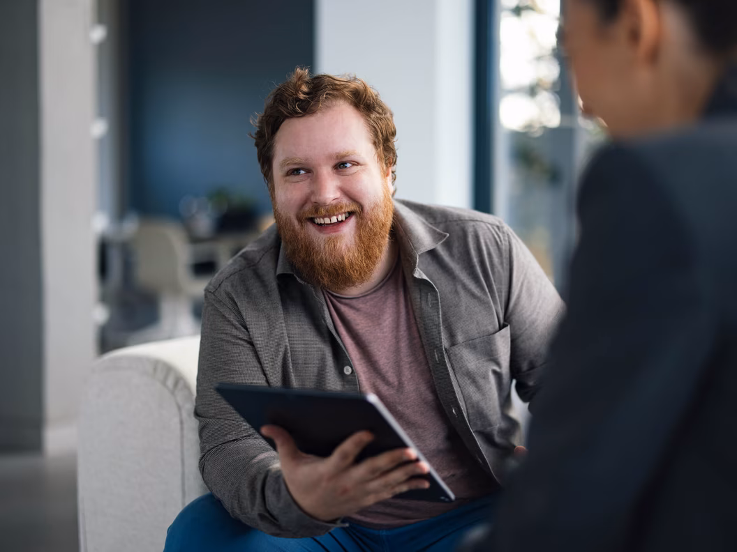 Man using a tablet in the context of modern Microsoft Cloud solutions
