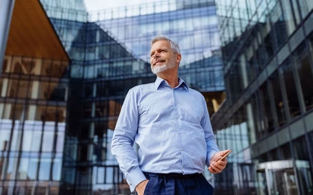 Man with a smartphone representing the practical use of data and AI solutions