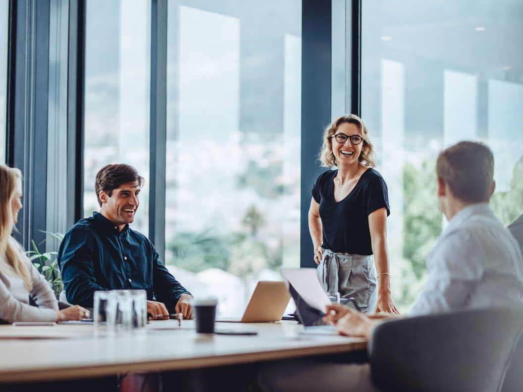 Office colleagues having a casual discussion during a meeting in the conference room