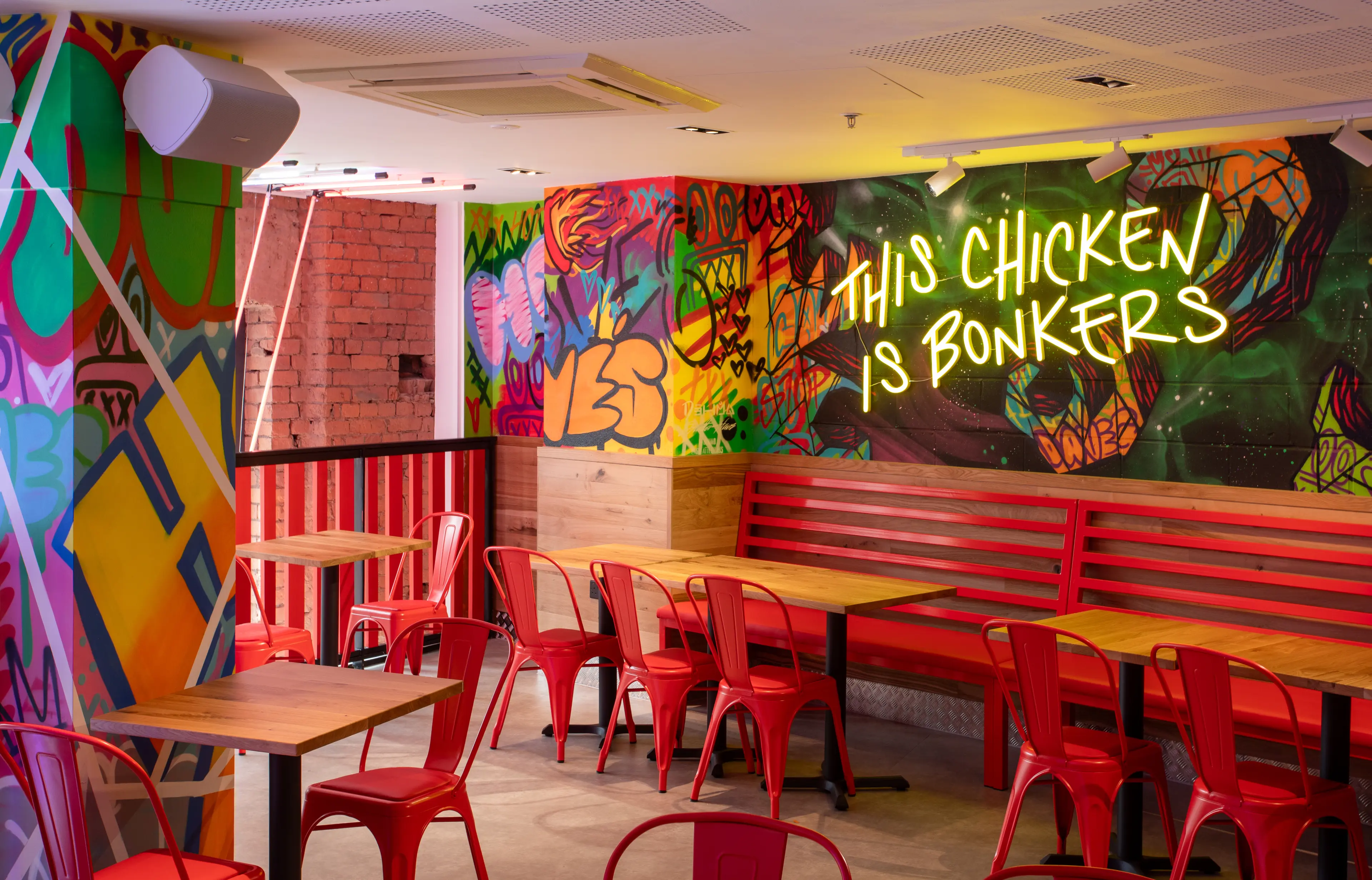 Colourful restaurant interior at Dave’s Hot Chicken