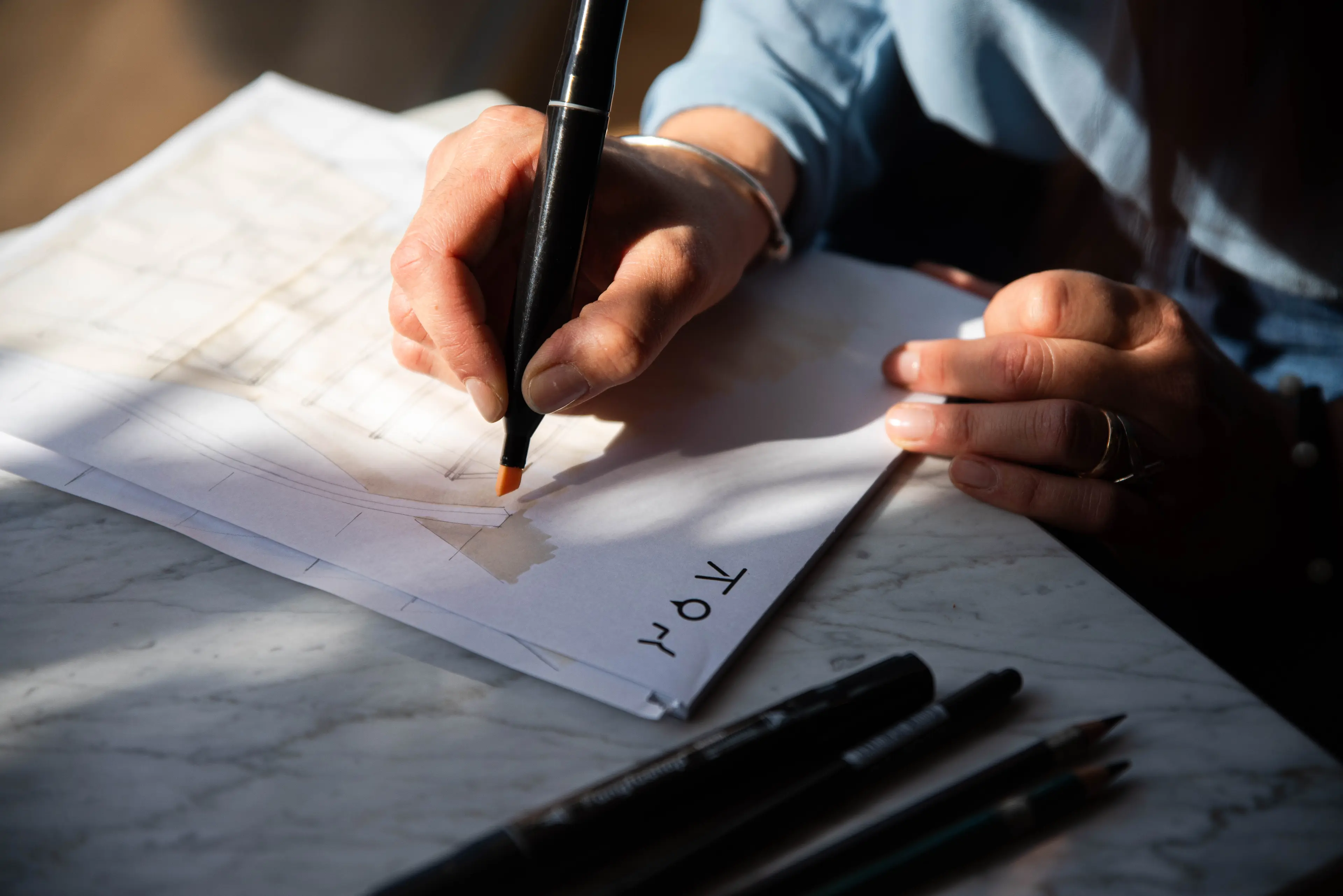 A furniture designer drawing plans