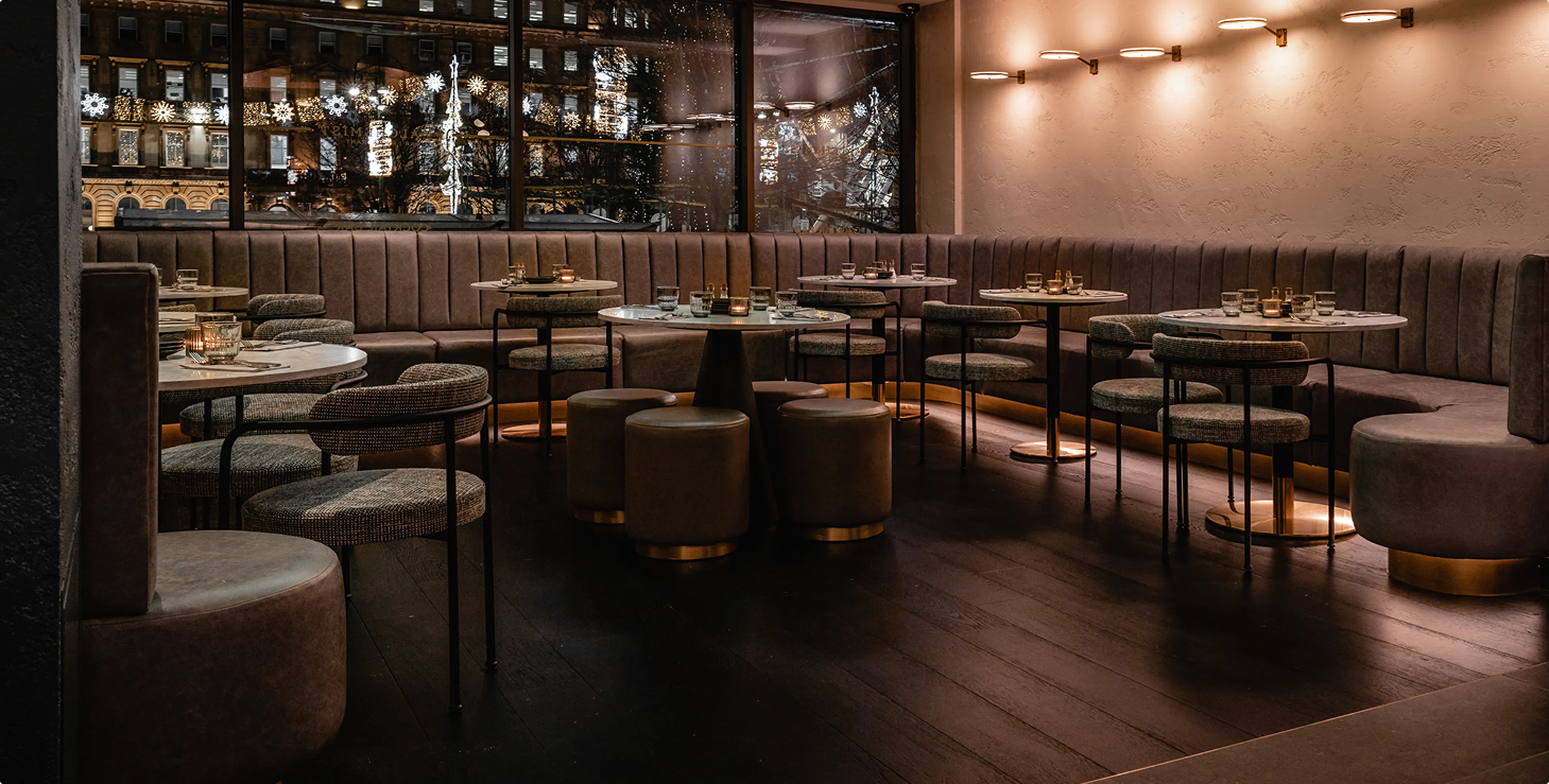 Restaurant bar with upholstered seating and dining tables