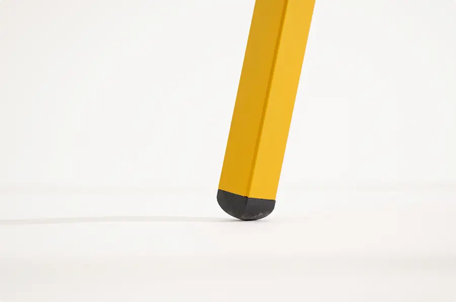 Protective foot on a yellow metal chair leg