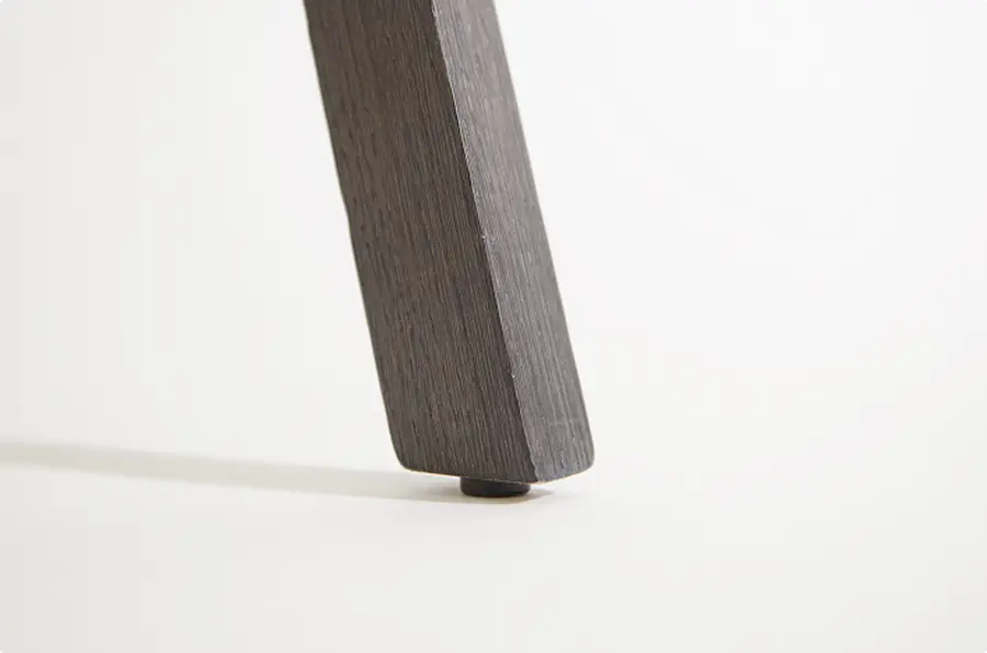 Protective glider beneath a timber chair leg