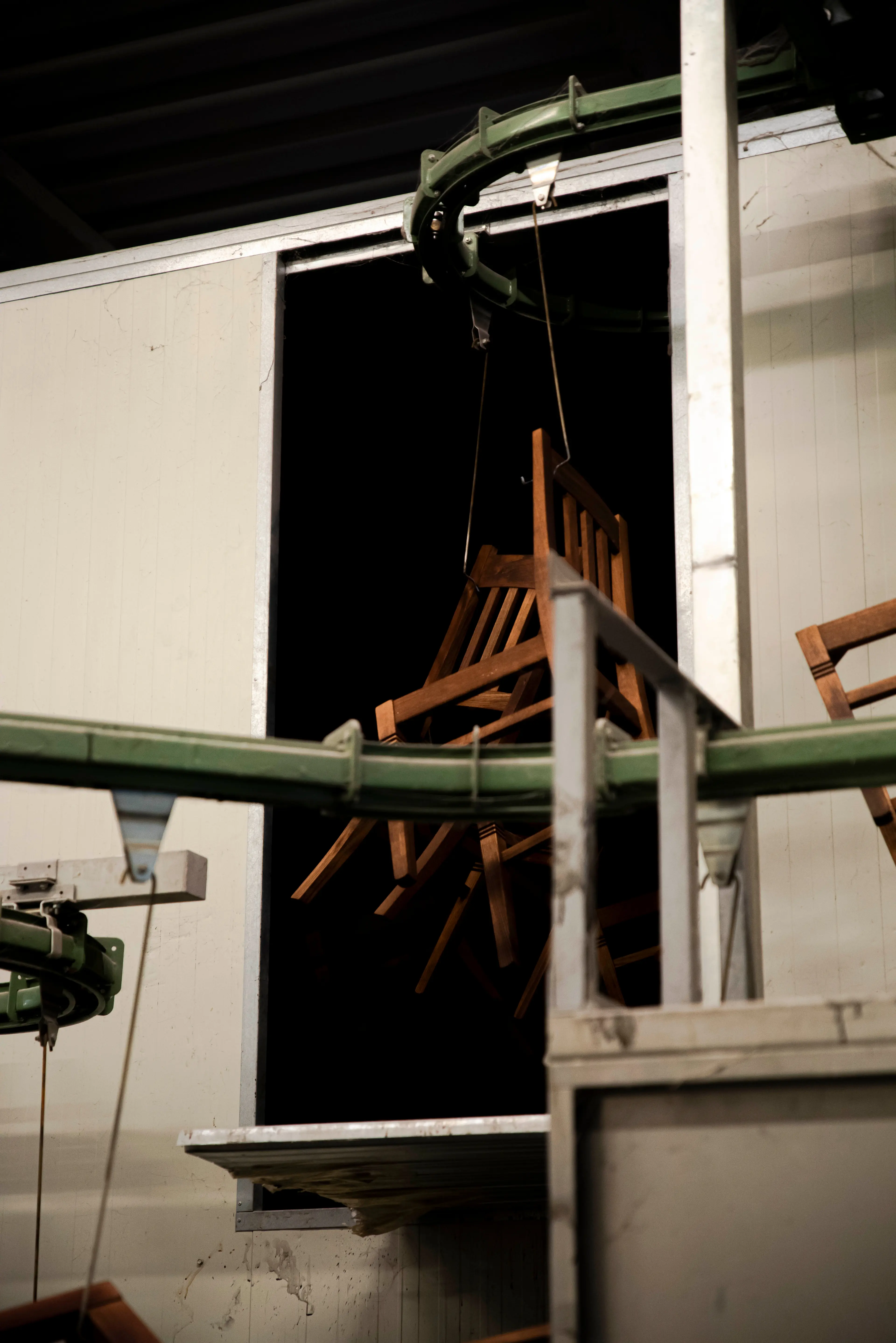 Wooden chair frames moving through furniture production