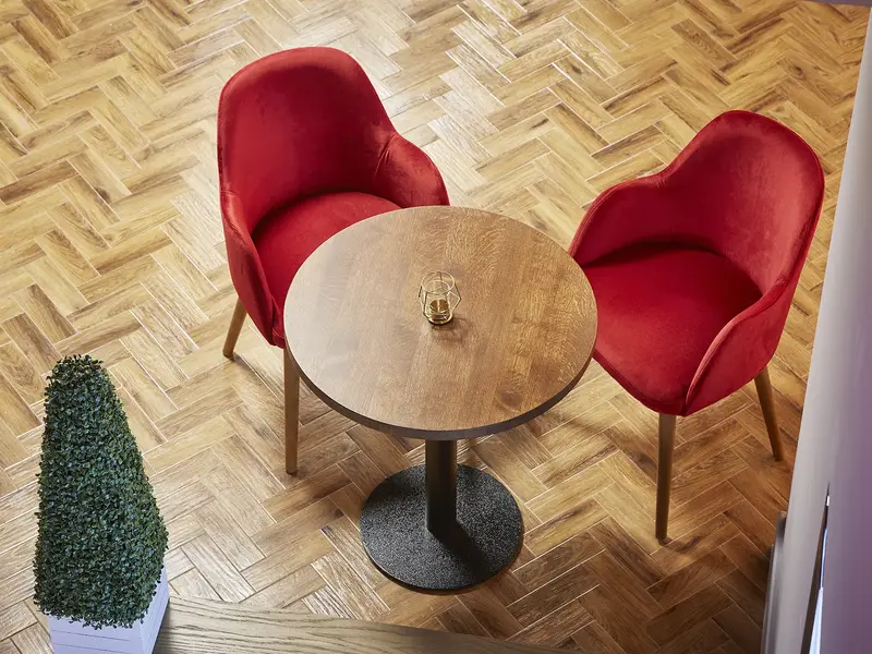 Geneva Armchair installed in a hospitality interior