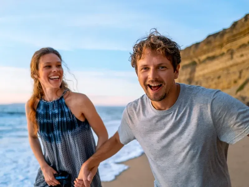 Couple running on beach