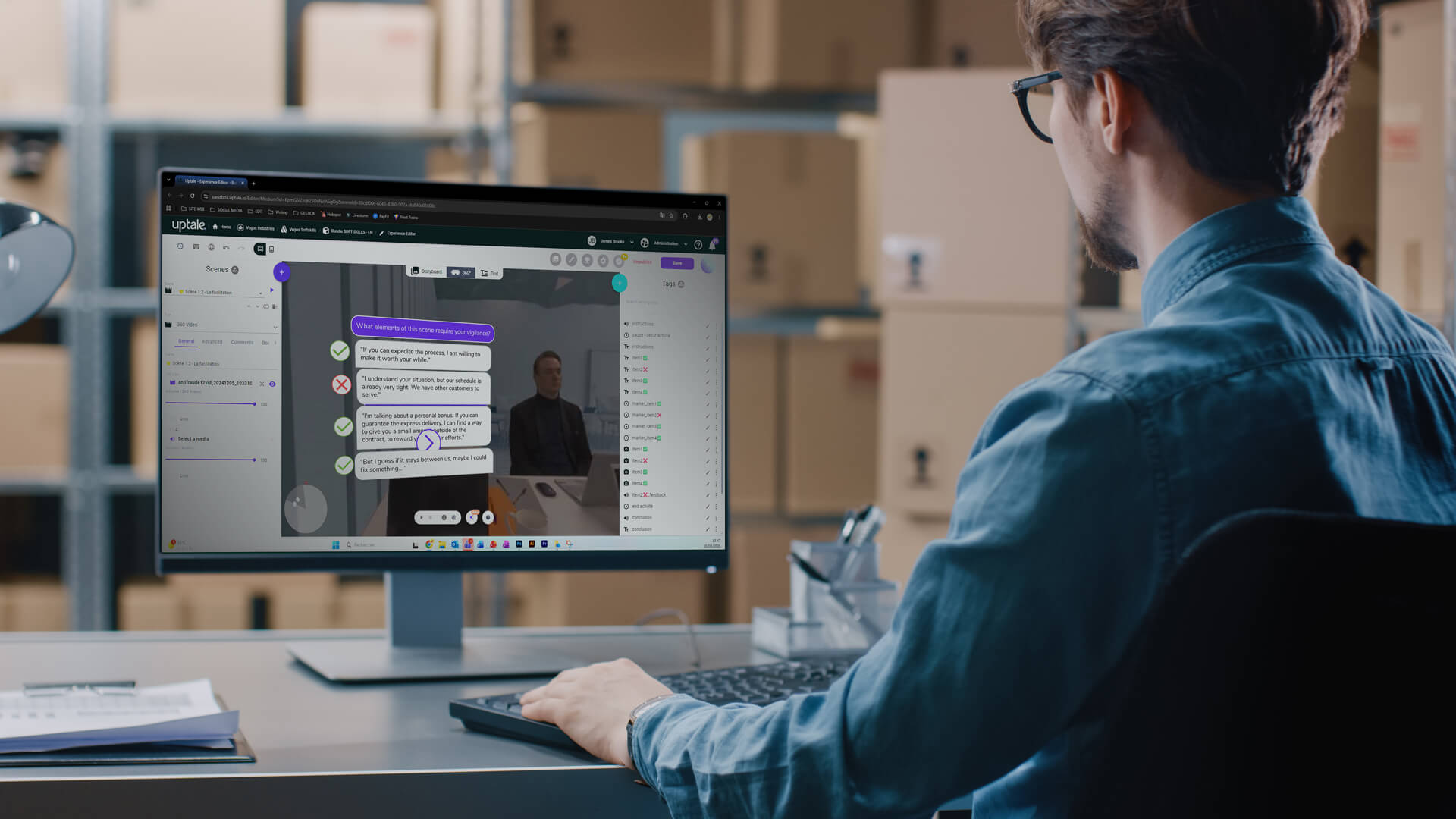 A person wearing glasses is sitting at a desk while looking at a computer screen displaying a business chat interface in an office setting.