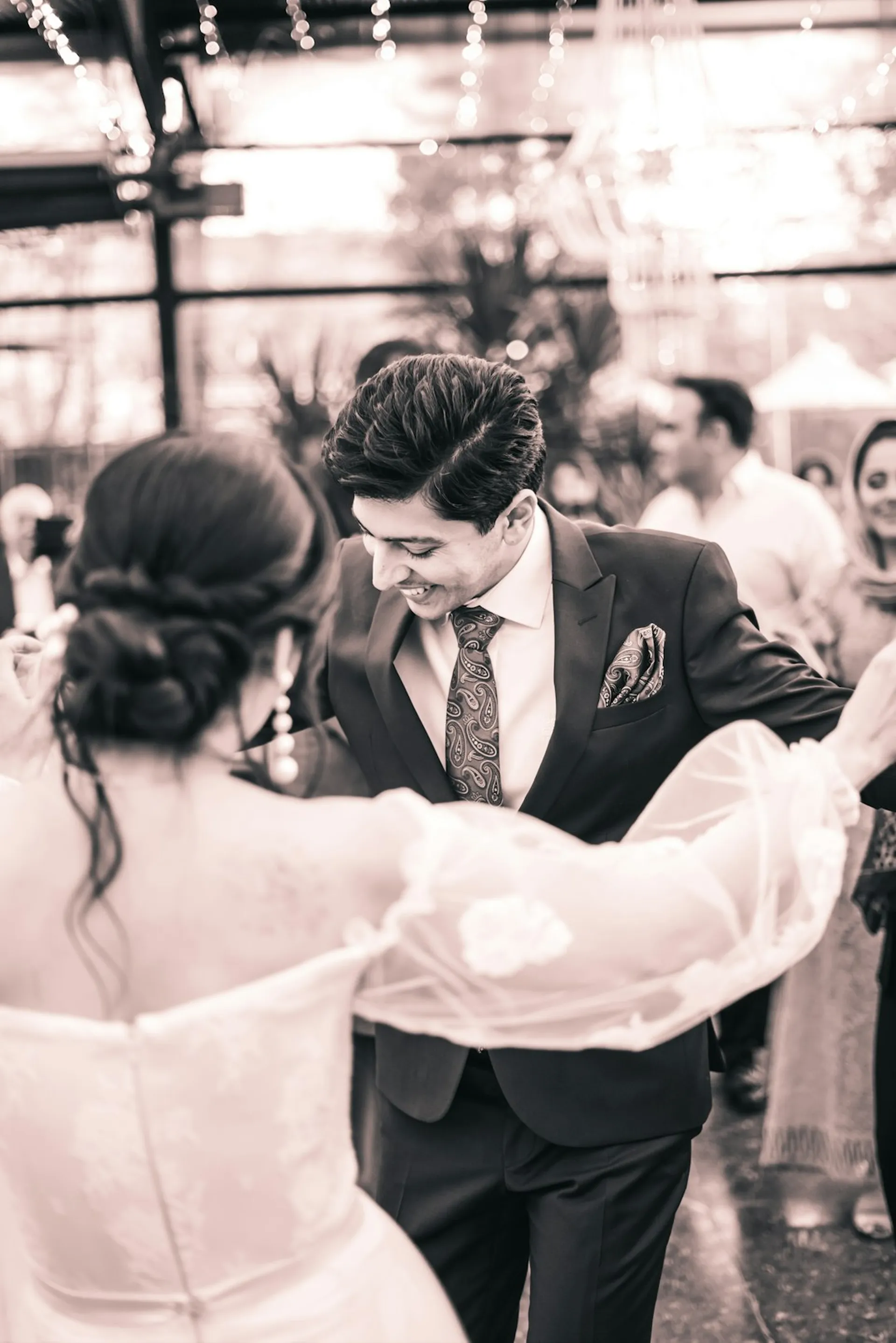 A couple dancing, in warm sepia film tones
