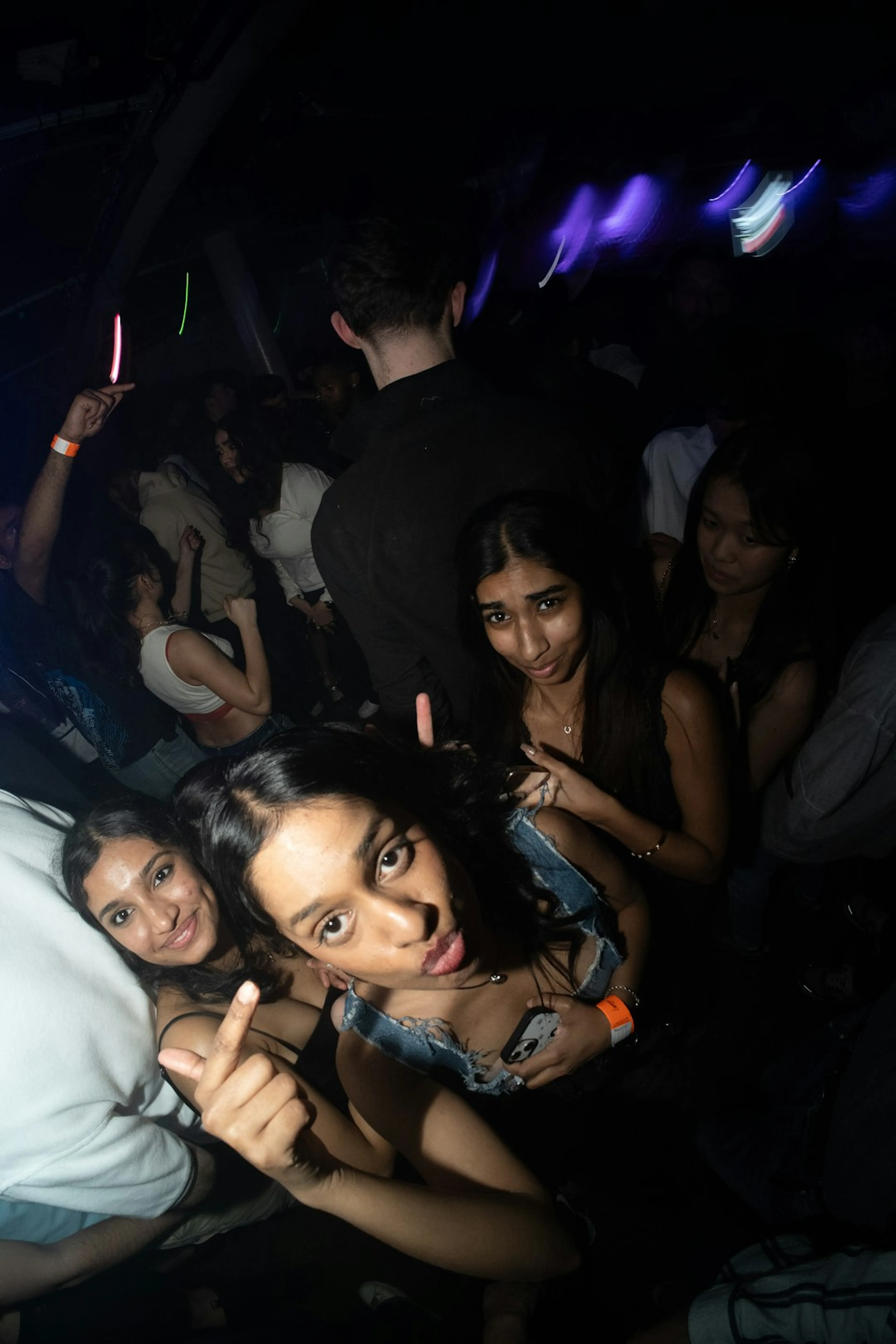 People posing together at a night-time event