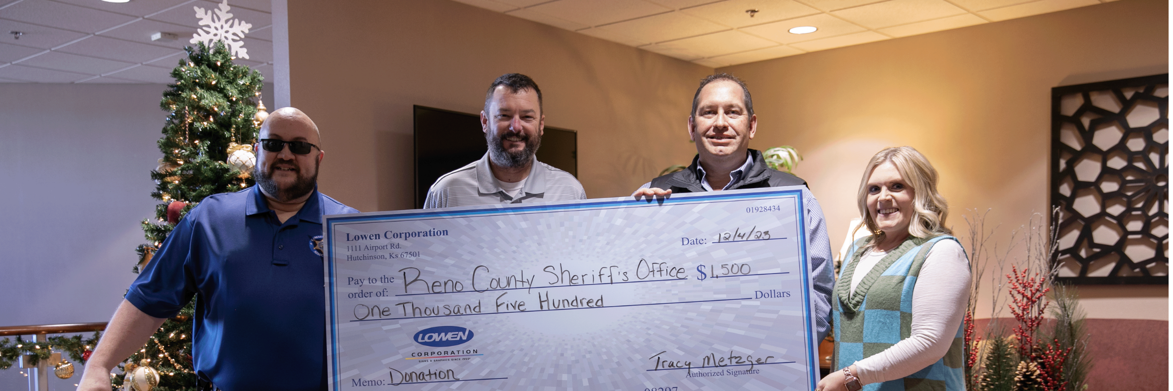 Lowen Corporation presents a $1,500 donation check to the Reno County Sheriff’s Office as part of $10,500 in community donations in Hutchinson, Kansas.