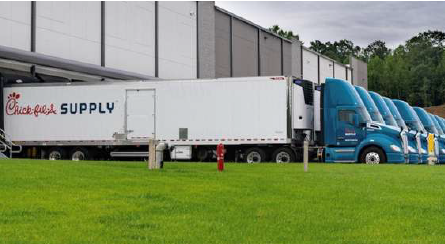 Chick-fil-A Supply delivery trucks with fleet graphics produced by Lowen Color Graphics.