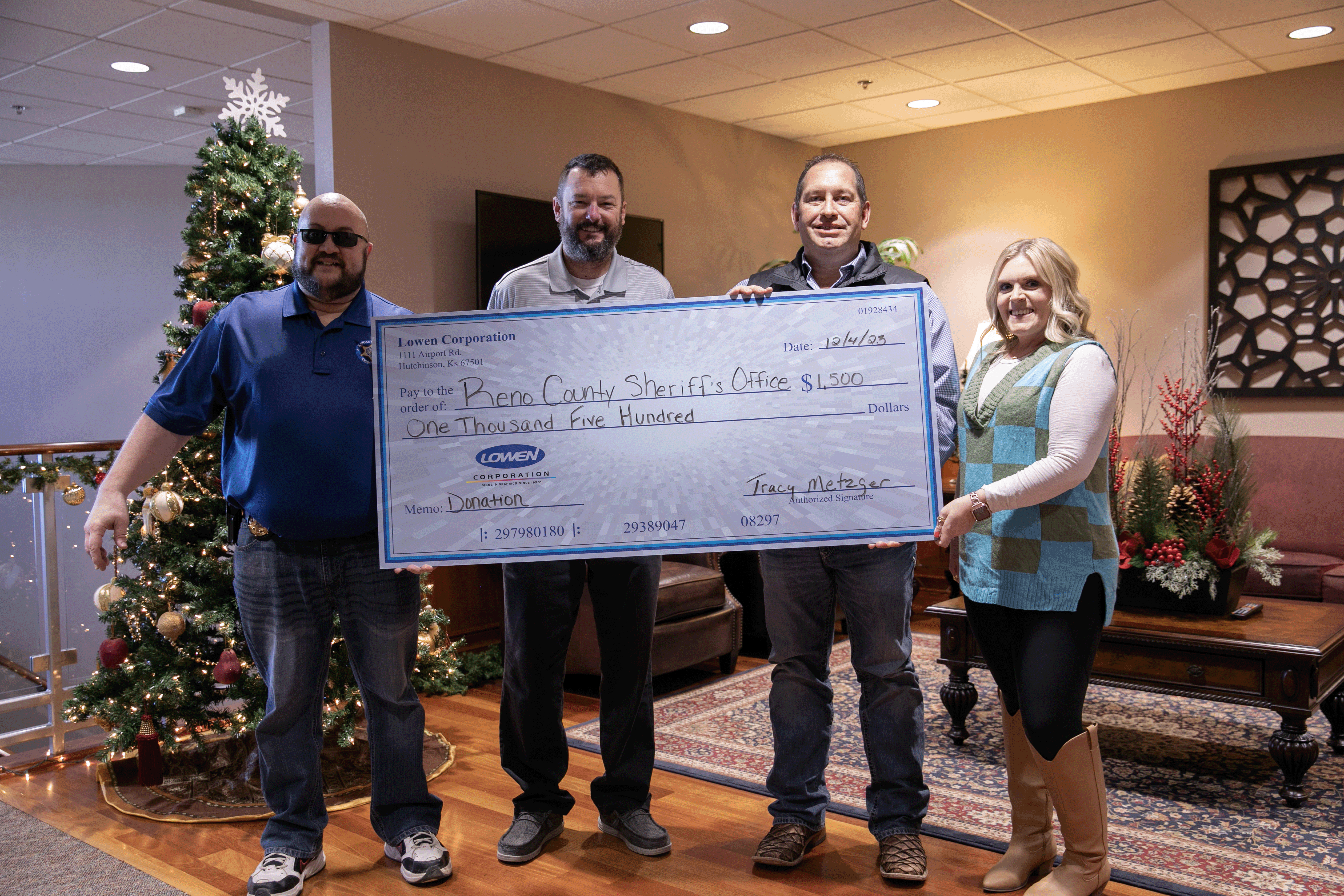 Lowen Corporation presents a $1,500 donation check to the Reno County Sheriff’s Office as part of $10,500 in community donations in Hutchinson, Kansas.