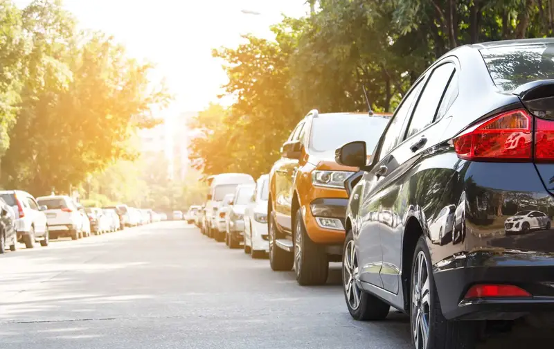 Parked cars street summer city