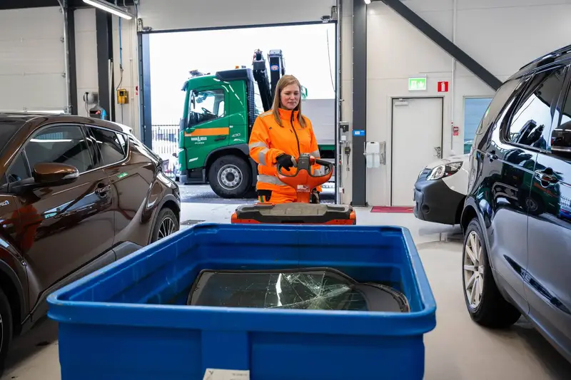 Staff woman with recycling material