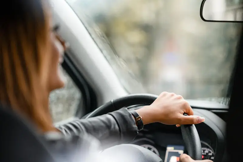 Smile woman driving