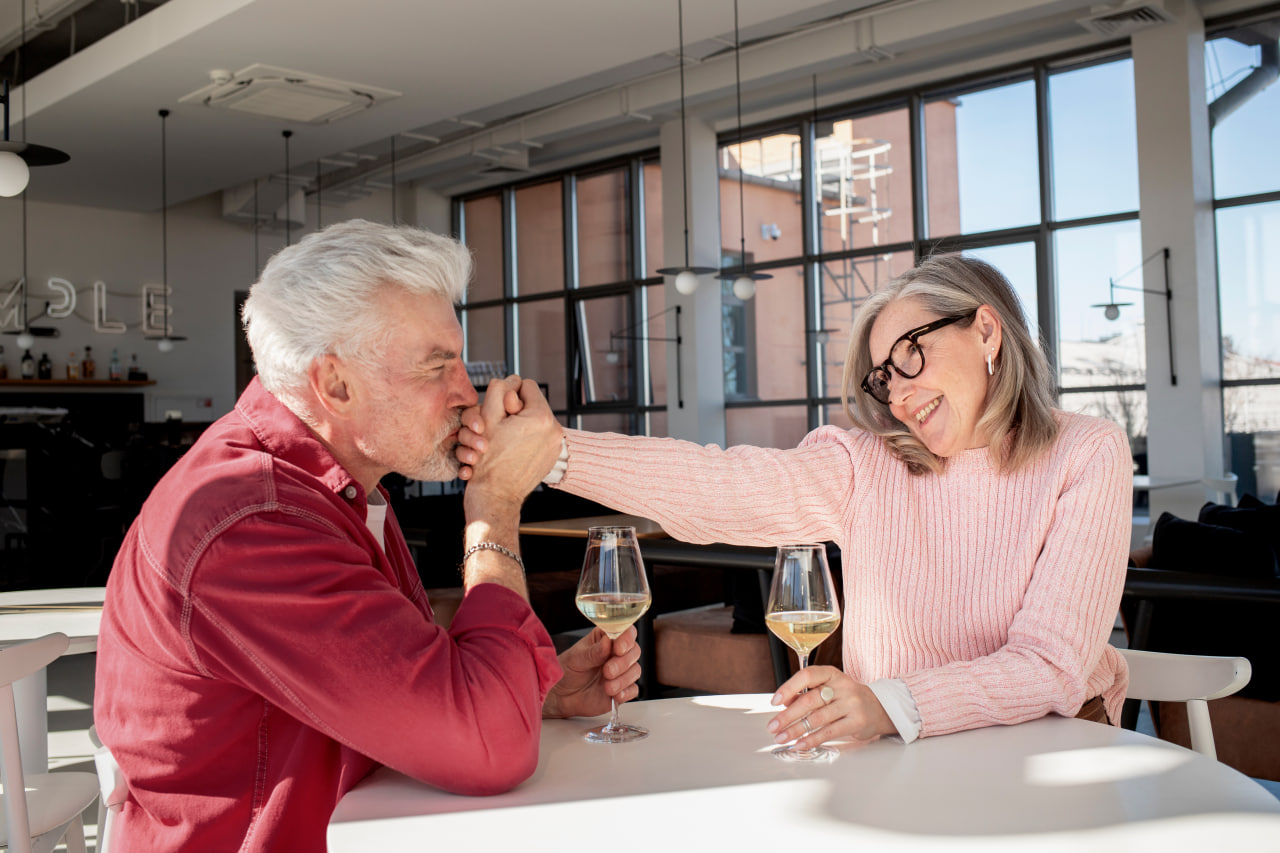 Senior couple enjoying wine together on a date