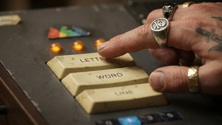 A hand pressing the Type Chopper Letter button on the TC-450.