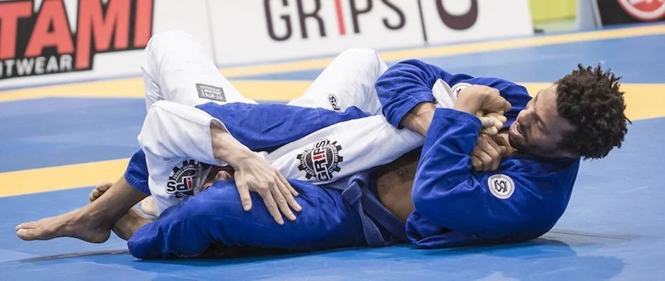 Two Jujitsu fighters grappling.