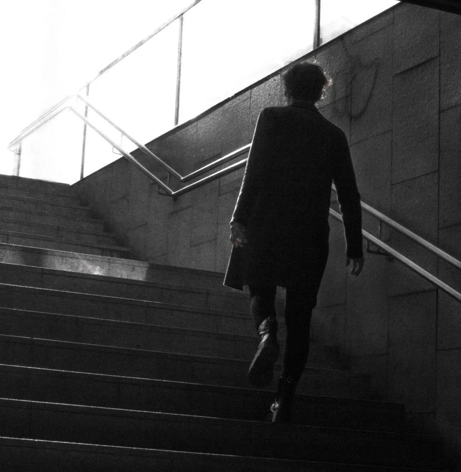 Strong woman walking into the light on her growth journey - Van Velvet.jpeg