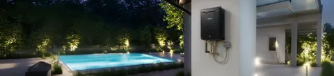 Rinnai gas continuous flow hot water unit in black on a wall.