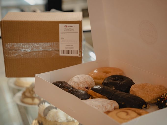 Opening up some fresh donuts from Avenue Bakery.