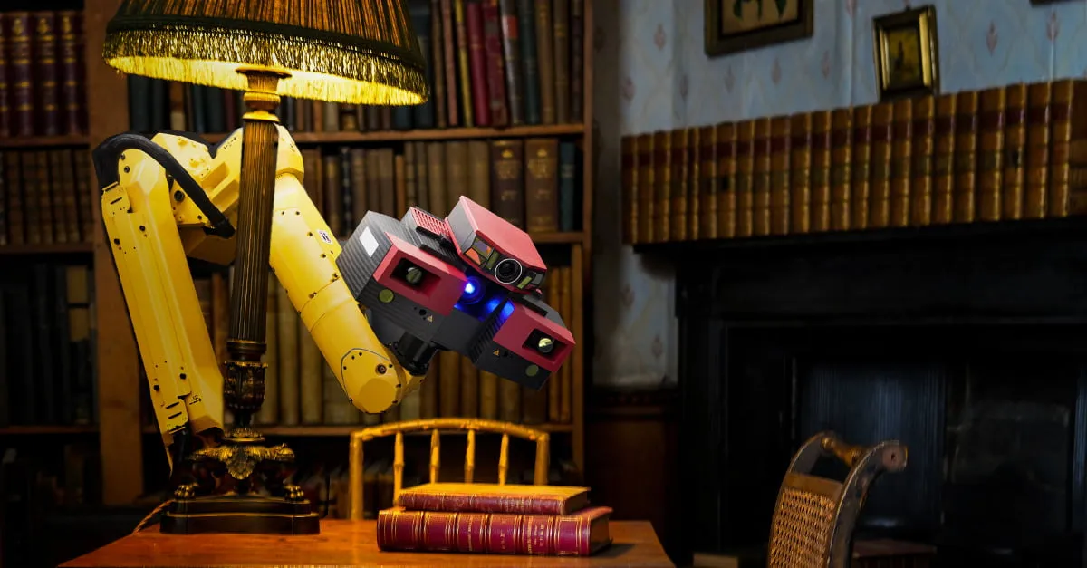 A yellow industrial robotic arm fitted with a scanning sensor head hovers over stacked leather-bound books on a desk in a book-lined study, as if reading them.