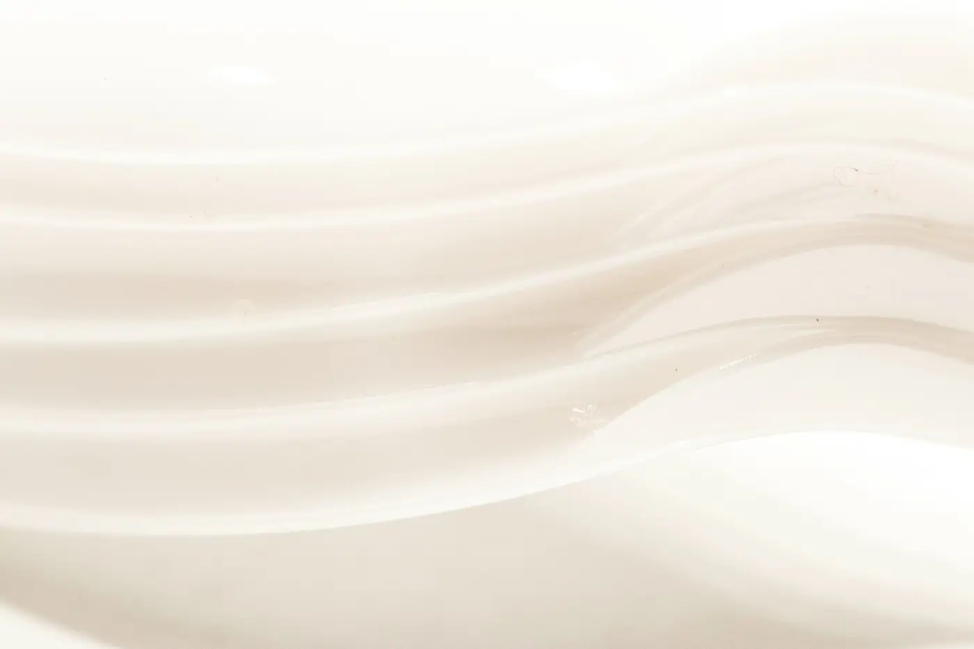Soft cream cosmetic texture with flowing folds of light