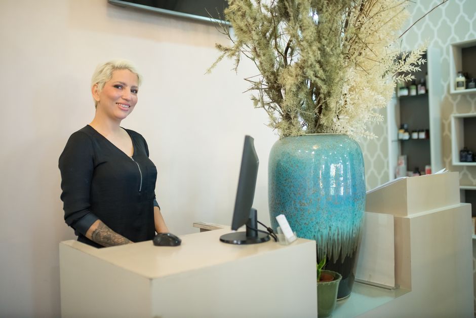 Wellness center reception desk with computer and management software