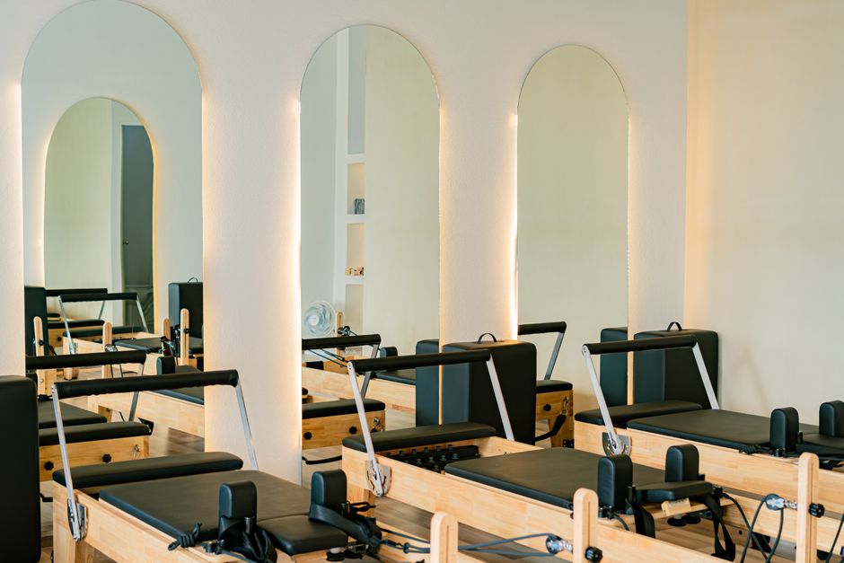 modern Pilates studio interior, the kind of multi-service wellness location a wellness management solution runs