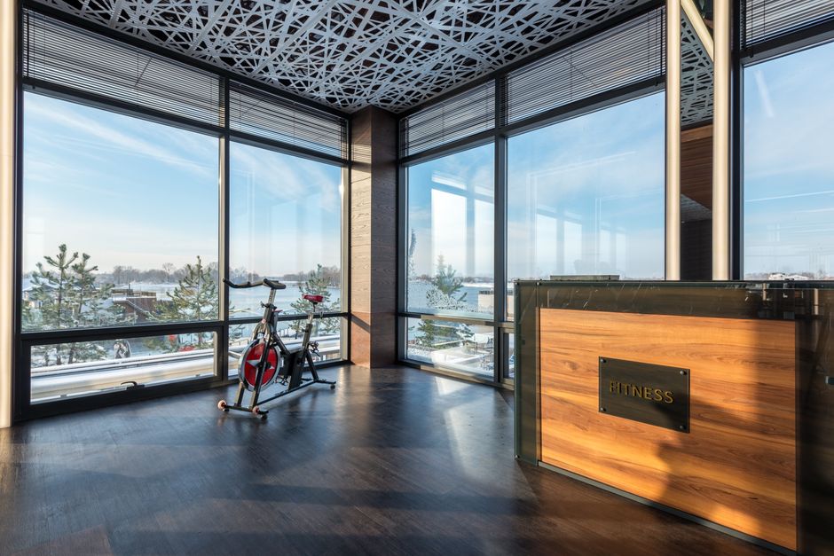 Modern fitness center with exercise equipment and natural light