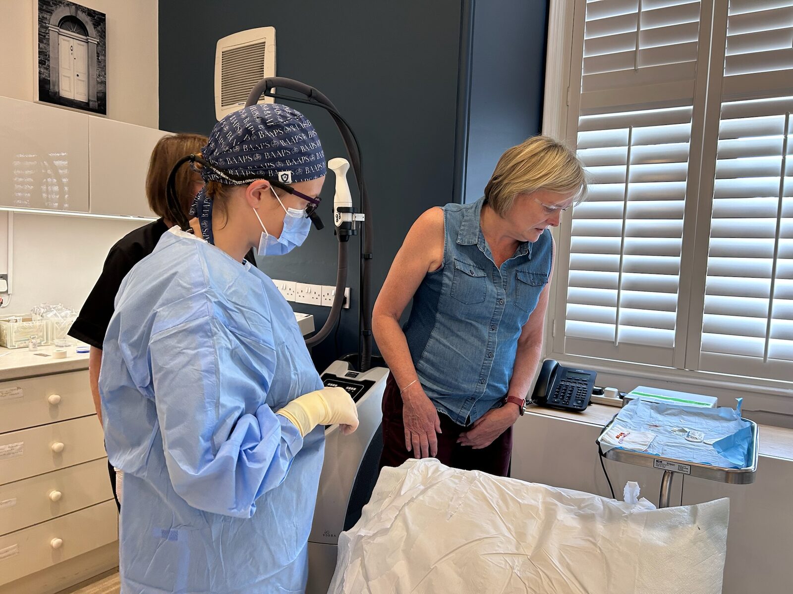 Dermatologist examining moles