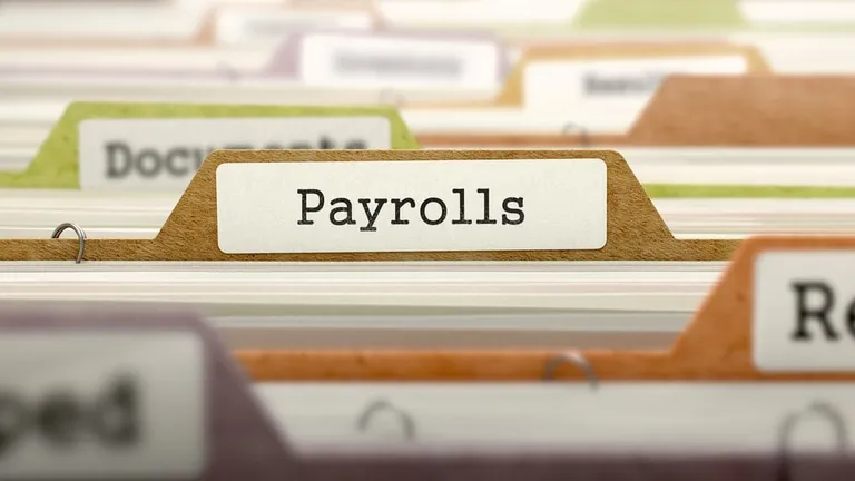 Payrolls folder register label in directory (close-up, blurred background)
