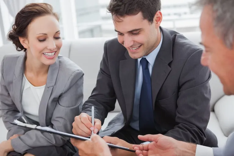 Businessman signing a contract in a meeting room