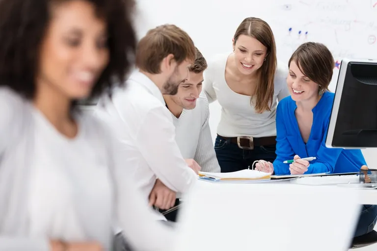 Diverse team discussing business strategy in office meeting