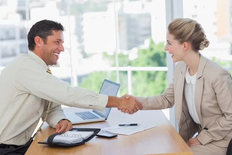 Blonde woman shaking hands while having an interview in office-Dec-18-2023-01-40-55-4397-PM
