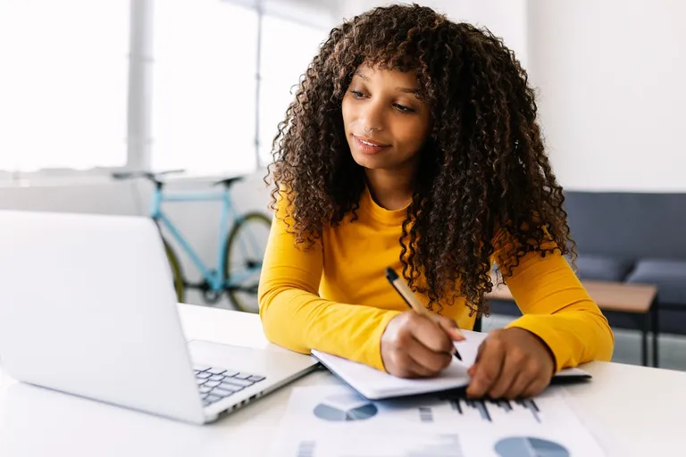 Young businesswoman working on a laptop at home