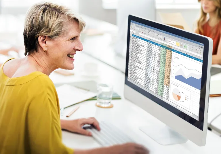 Manager reviewing payroll cash-flow and budget timing
