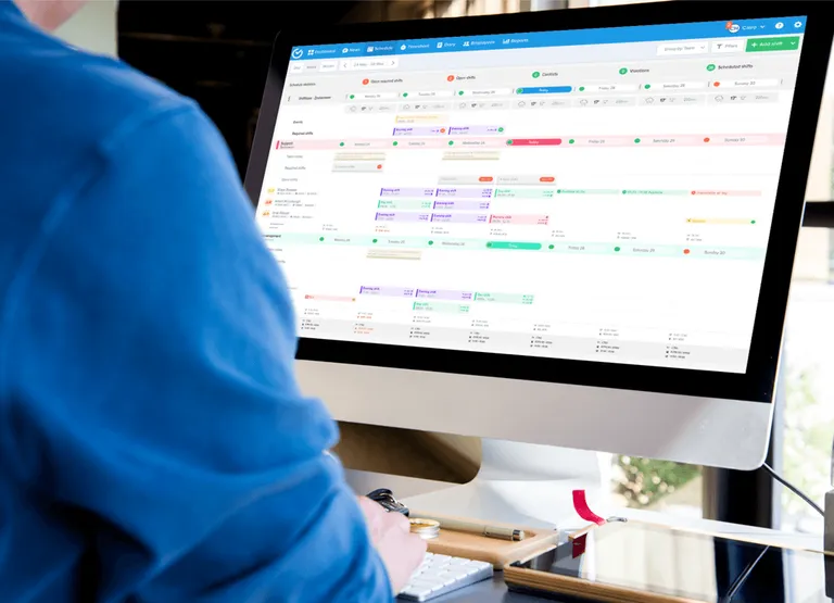 Manager using Shiftbase scheduling tool to create employee schedules