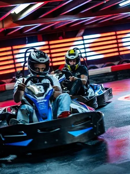 Karts racing on the GameCity indoor track