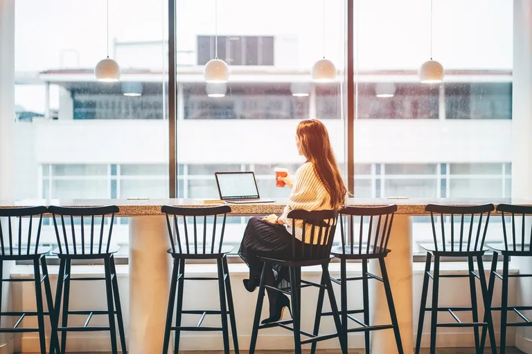 Businesswoman working in modern co-working space