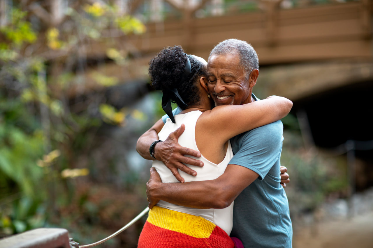 Senior couple embracing in a warm outdoor hug